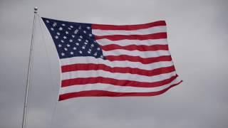 American flag flaps during heavy wind storm