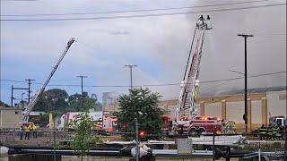 Crews battle fire at downtown Grand Rapids recycling center