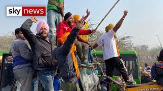 India: Tear gas fired as farmers clash with police in Delhi