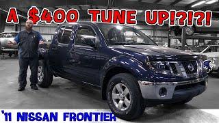 How can a tune up cost $400? CAR WIZARD explains how modern maintenance is done on this '11 Frontier