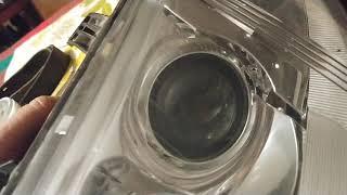 cleaning internal projector lens in a car headlight using a cotton swab