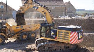 Cat 352F Loading New 730 Trucks