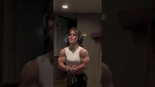 FBB Kira Plagemann flexing shredded biceps