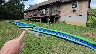 I made a solar heated 50 foot long slip n slide with a drop off and an extra deep splash pool DIY