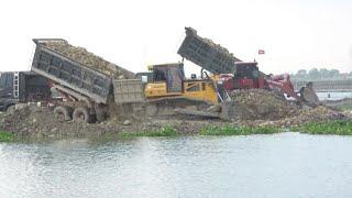 Fantastic machinery Operating skill rocks soil pushing Bulldozer wheel loader and truck