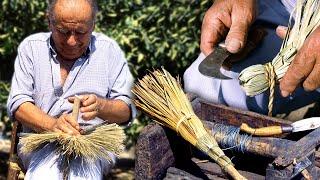 Handmade brooms with palm leaves. This was the trade of these artisans of yesteryear.