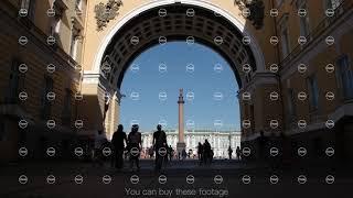 Silhouette of tourists through the arch of the general staff on the Palace square background