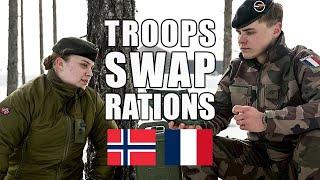 French  and Norwegian  soldiers swap meals-ready-to-eat rations 