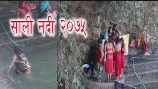 Holy bath Hindu women bathing outdoor at Sali nadi