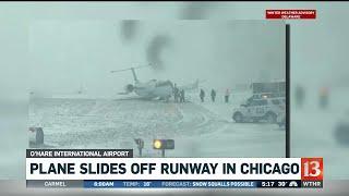 Plane slides off runway in Chicago