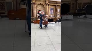 Jian Wang testing, comparing great Cellos. M. Goffriller
