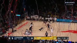 confetti falls on the court in the middle of Duquesne vs VCU game