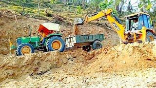 JCB 3dx backhoe loading mud in trolley with John Deere 5310/JCB backhoe loader/. mountain king jcb