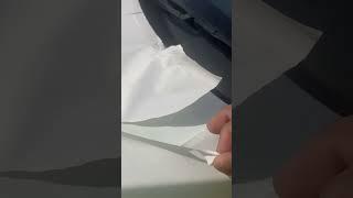 Remove paint cover from brand new car