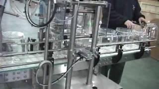 Packline PAO - 1: INLINE JARS FILM SEAL & CAPPING MACHINE