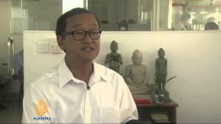 Cambodia opposition leaders summoned to court