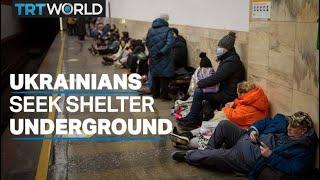 Citizens in Ukraine seek shelter inside train stations, bunkers