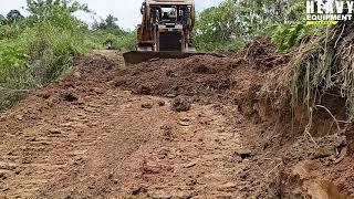 The highest Risk Job Bulldozer Caterpillar D6R XL Cutting Hill On Mountain Road Construction