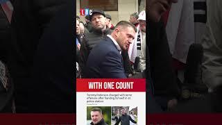 Tommy Robinson charged under Terrorism Act as he hands himself into police | LBC