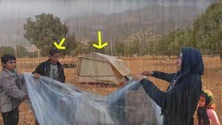 A terrible storm: two boys help Akram to cover her tent