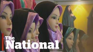 Iranian women add fashion to hijab