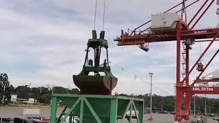 Export from Russia. Unloading of a cargo ship. Seaport. IEC.