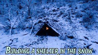 BUILD a SHELTER in SNOW.| I built a wooden hut with FIREPLACE | under °ZERO DEGREES.
