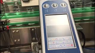 Assembly line water bottle cap coding machine