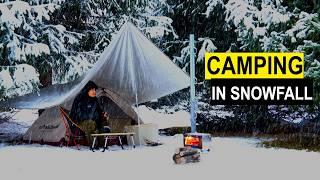 Hot tent camping in snowfall. I cook on a wood stove.Camping in a Heavy Snowstorm