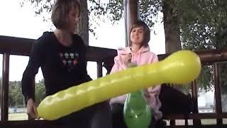 2 girls blowing worm balloons!!