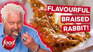 Guy Fieri Tries DELICIOUS Braised Rabbit | Diners, Drive-Ins & Dives