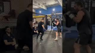 Javier Mendez Holds Pads for Thunder Kicks of Magomed Kurbaitaev