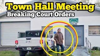 BREAKING THE LAW AT TOWN HALL MEETING