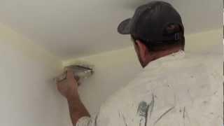 The Real Trick on how to paint a straight ceiling line using a 4 inch paint brush to cut in walls.