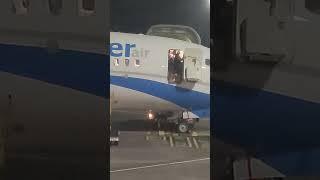 Stewardess Receives Help Closing Airplane’s Door