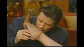 Kelly Ripa gets her foot and leg kissed by Alec Baldwin