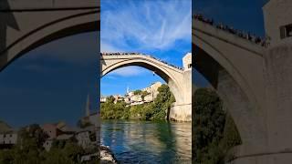 This guy makes money by jumping off Mostar bridge for 5 Euros in Bosnia Herzegovina #shorts #bosna