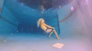 Zoey Goes Swimming Underwater At Night
