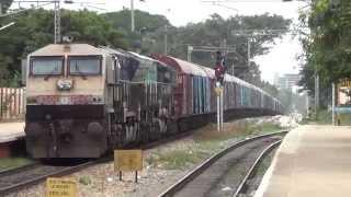 UBL WDG4 twins haul a cement carrier on a roller coaster track