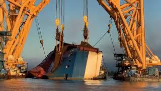 Heavylift ship uses chain to cut through capsized car carrier