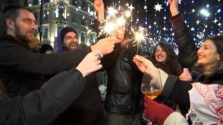 Thousands celebrate new year in front of parliament in Georgia capital as protests continue