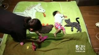 Japan mom uses sleeping baby in art project