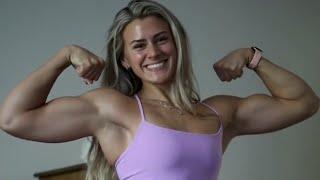 Beautiful muscle girl flexing