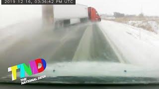 Semi Truck jackknife across snowy Kansas highway