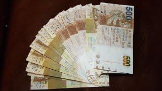 $10,000 Hong Kong banknotes to look through
