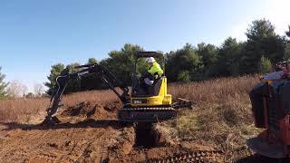 Student goes over trench with mini excavator and shows what not to do when you cross the trench