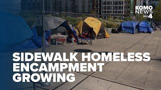 Encampment on sidewalk between South Lake Union and Seattle Center continues to grow