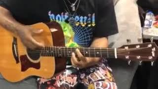 Juice wrld playing a guitar