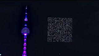 Drones form working QR code in China sky