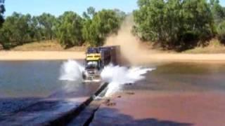 Road Train going flat-out over a river crossing - Western Australia